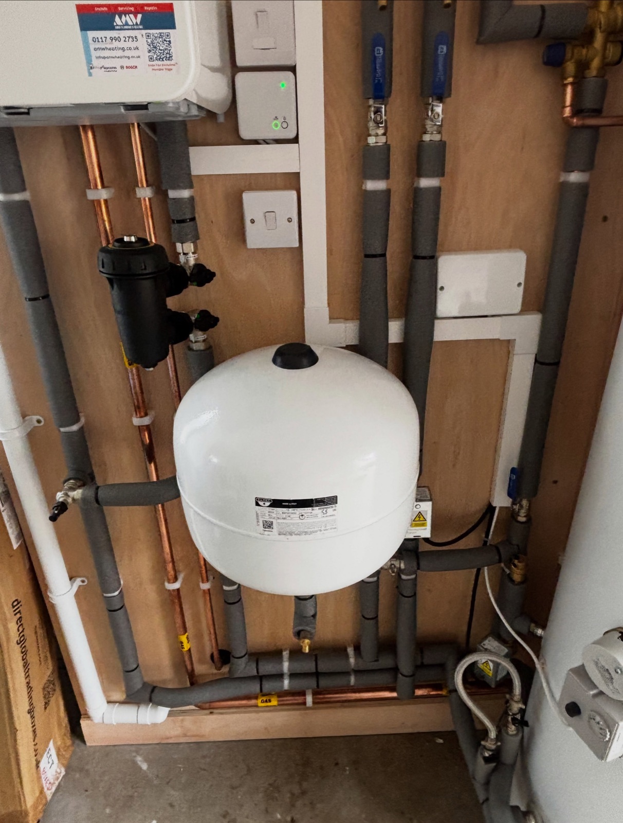 Expansion vessel, filter and heating pipework on a boiler installation